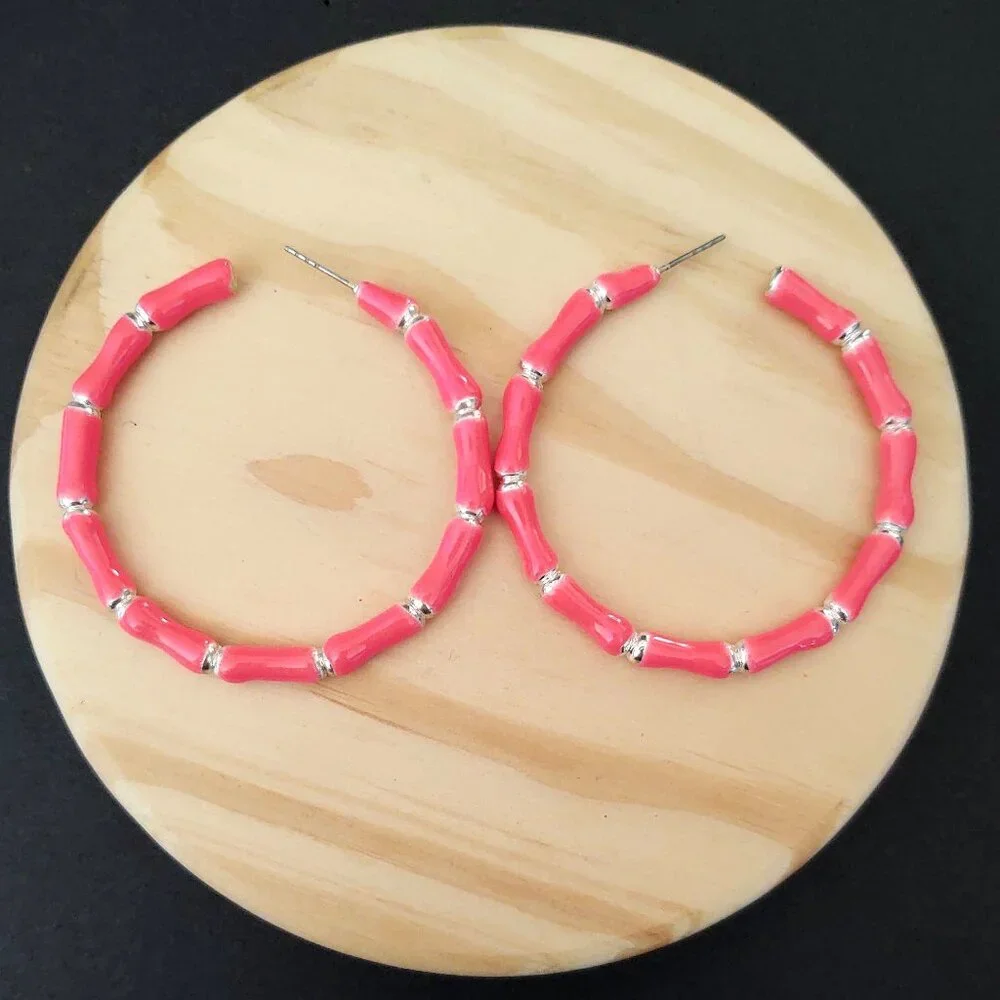 Bright glossy salmon pink enamel and silver tone hoops